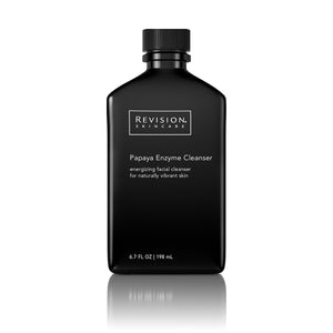 Black bottle with screw top of Revision Skincare Papaya Enzyme cleanser. This product is a energizing facial cleanser for naturally vibrant skin. 