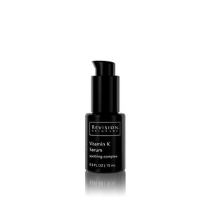 Small black pump bottle of Revision Vitamin K serum soothing complex. 