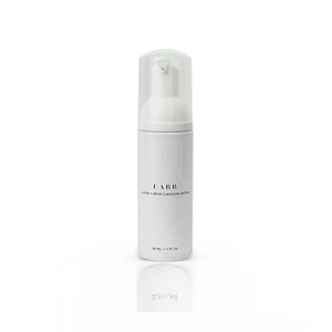 White bottle with a pump top of LABB eyelash and eyebrow cleansing bath. 